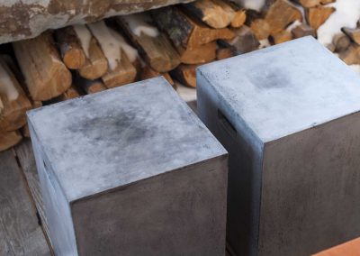 concrete stools outside at the Yellowstone Club Residence designed by Elizabeth Robb Interiors