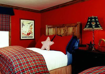 bedroom with two queen beds at the Aspen Ranch designed by Elizabeth Robb Interiors