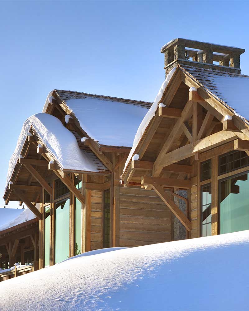 snowy exterior at the Spanish Peaks Residence designed by Elizabeth Robb Interiors