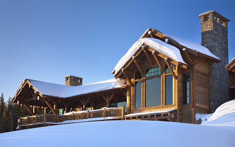 snowy exterior at the Spanish Peaks Residence designed by Elizabeth Robb Interiors