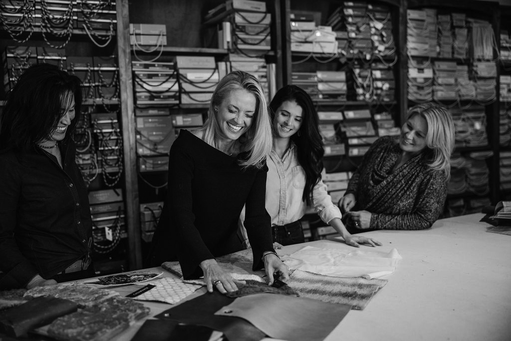 Dana Talbot, Elizabeth Robb, and Linnaea Keane working on a design project at the Elizabeth Robb Interiors studio