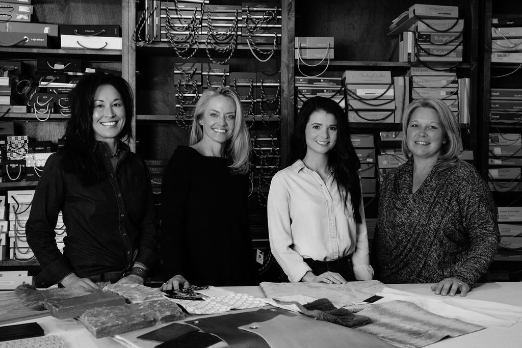 Elizabeth Robb, Dana Talbot, and Linnaea Keane working on a design project at the Elizabeth Robb Interiors studio