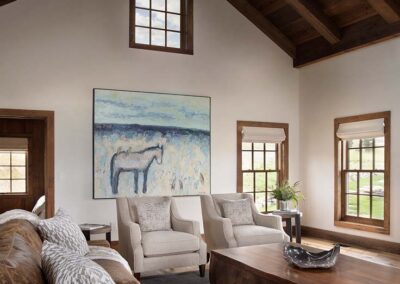 Living room design with large painting focal point